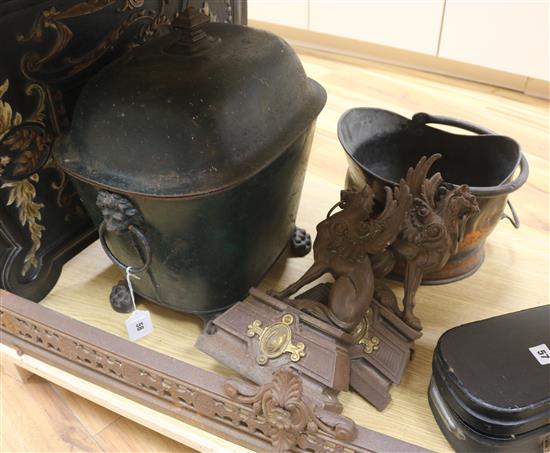 A carved ebonised fire screen, green toleware coal bucket, fender etc